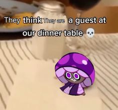 a purple mushroom sitting on top of a table