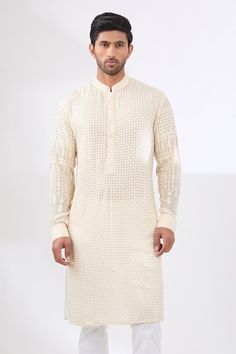 Ivory kurta with sequin and thread tonal embroidery in geometric pattern. Paired with a white pant. - Aza Fashions Traditional Wedding Wear With Geometric Embroidery, Cream Kurta With Resham Embroidery For Traditional Ceremonies, Cream Kurta With Cutdana For Traditional Ceremonies, Off White Kurta With Intricate Embroidery For Festivals, Off-white Kurta With Intricate Embroidery For Festivals, Elegant Festive Kurta With Geometric Embroidery, Off White Kurta With Mirror Work Traditional Drape, Traditional Kurta With Chikankari Embroidery For Reception, Off White Zari Work Kurta For Transitional Season