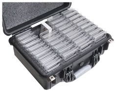 an open black case filled with lots of silver items on top of a white surface