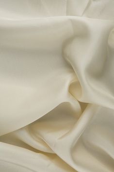 Whisper White Habotai Silk Fabric is a light, delicate silk fabric with a smooth finish and flowing drape. Habotai is most often used in eveningwear, home decor, and sportswear. The word "habotai" derives from the Japanese word, which literally means "feather-two layer". Habotai is also sometimes referred to as "China Silk". Our habotai is 100% silk and woven in South Korea. The fabric is lightweight and adaptable and is most often used as a lining fabric - the silk fibers give this fabric great breathability and absorbency which makes it perfect for lining suits, jackets, and other garments. Fabric Weight: 8 MM The fabric is sold by the Yard, and measures 44 inches in width. Japanese Word, Habotai Silk, Dupioni Silk, Whisper White, Japanese Words, Organza Fabric, Silk Wool, Wool Fabric, Lining Fabric