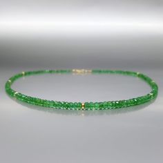 Fine precious green Colombian Emerald necklace with solid 14k gold. Unique gift for her, girlfriend, wife, May birthstone, 20 and 35 year anniversary. Extraordinary green beads of Emerald, faceted to perfection in many small faces, sparkling and shining with an elegance. The necklace is enhanced with tiny 14K gold beads. All our stones are natural stones and our jewelry is handmade, slight differences in color and size may occur. The stones are strung on stainless steel for maximum hold and fini Gold Tsavorite Emerald Necklace For May Birthstone, Elegant Green Briolette Gemstones, Faceted Yellow Gold Necklaces For May Birthstone, Elegant Single Strand Green Emerald Necklace, Green Faceted Beads Jewelry For Gift, Green Faceted Beads Jewelry As Gift, Gold Emerald Rondelle Necklace, Elegant Single Strand Green Gemstones, Elegant Faceted Briolette Emerald Necklace