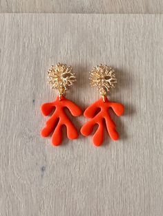 Saturated colour, super bright coral orange paired with 18k gold-plated coral stud makes the perfect chic statement earrings! 18k Gold Hardware & Polymer Clay Your earrings will arrive in a handmade jewellery bag, gift-wrapped and with 100% plastic-free packaging, ready to gift. Handmade in Margaret River, Western Australia. All earrings are made from polymer clay which gives a lightweight result. My process includes mixing my own colours, baking, sanding, buffing, and assembling.  - CARE INSTRUCTIONS - Store in a clean, dry place. Do not swim, sleep or exercise in your handmade accessories or earrings. They may break if twisted, bent or dropped.  Do not let your accessories come into contact with aerosol sprays, creams/lotions. It will affect and erode the finish and affect longevity of y Handmade Coral Earrings For Party, Bold Orange Drop Earrings, Margaret River Western Australia, Cute Christmas Stockings, Jewellery Bag, Margaret River, Little Christmas Trees, Stocking Gifts, Cream Lotion