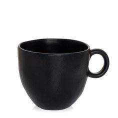 a black coffee cup sitting on top of a white table