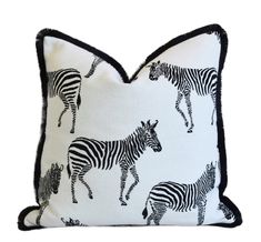 a pillow with zebras printed on it