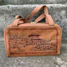 "Vintage 60s women bag, Tan leather bag, embossed handbag \"Chinese motif\", Retro style, a bag with handles Elegant vintage women bag \"Ballet\", light brown in color with two handles. Made in China in the 60s from genuine leather with an embossed image. This bag is from the times of Soviet-Chinese friendship. Retro style. Well preserved for its age. The latch works fine. The lining is whole. There is a slight dusting. In places slight scuffing of the skin. The bag is very roomy, comfortable, a Vintage Embossed Satchel For Everyday Use, Vintage Brown Embossed Shoulder Bag, Vintage Embossed Satchel Bag, Vintage Brown Embossed Satchel, Rectangular Embossed Satchel For Travel, Daily Use Rectangular Embossed Satchel, Vintage Embossed Shoulder Bag For Daily Use, Vintage Embossed Tote Bag, Vintage Embossed Leather Bags