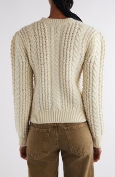 Classic cables texture this chunky virgin-wool sweater knit in Italy with a touch of gathering at the puff shoulders. Crewneck Long sleeves Ribbed cuffs and hem 100% virgin wool Dry clean Made in Italy Designer Clothing Elegant Cream Chunky Knit Sweater, Cream Wool Cable Knit Cardigan, Cream Merino Wool Chunky Knit Sweater, Cream Wool Cardigan With Ribbed Cuffs, Stitch Sweater, Cable Stitch, Fabric Gift Bags, Nordstrom Store, Fabric Gifts