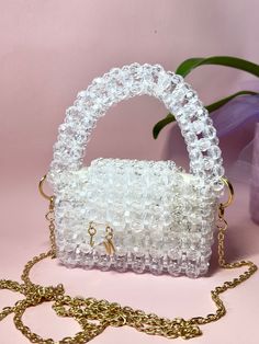 Mini Crystal bag, handmade. There is also a pouch for storing your handbag. Length 5 in Width 3 in Height 3 in(with handle 6 in) Tote Bags With Pearl Handle, Rectangular Bags With Pearl Handle For Daily Use, Satchel With Mobile Phone Bag In Pouch Shape, Daily Use Tote Bag With Pearl Handle, Trendy Rectangular Satchel As Gift, Trendy Handheld Box Bag Gift, Top Handle Mobile Phone Bag As Gift, Pearl Handle Shoulder Bag For Everyday Use, White Bags With Pearl Handle For Daily Use