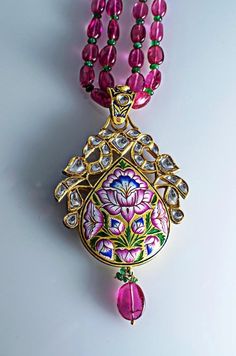 Jewelove Masterpiece This is one of our most exceptional pieces. A two-sided diamond polki & enamel pendant which took us months to create. This pendant by Jewelove showcases the exquisite craftsmanship of Meenakari (enamelling) for which the were invited to Jaipur by the founder King of Jaipur & for which the are most well known. The image that you see above is supposedly the front side of the pendant, which has an array of diamond polkis in the center with two peacock birds on top enli Luxury Meenakari Sets In Dola Silk, Jaipur Jewelry Diamond, Luxury Bollywood Jewelry With Meenakari, Luxury Bollywood Jewelry With Meenakari Details, Luxury Fusion Meenakari Jewelry Sets, Luxury Meenakari Jewelry For Festive Season, Luxury Blue Meenakari Jewelry, Luxury Meenakari Jewelry For Festive Occasions, Luxury Meenakari Necklaces For Designer Wear