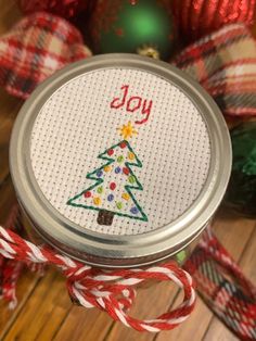 a christmas ornament in a jar on a table