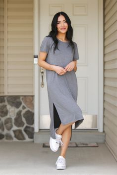 This is the perfect dress to feel comfortable in. It reminds us of the comfort your favorite tee shirt brings that you’ve kept for years! This dress is no different. Have your comfort in style with our slit hem tee shirt dress. Models are 5’6” and 5'8" wearing a size small Length of a small is 41" in the front and 47" in the back 95% Polyester, 5% Spandex Winter T Shirt, Cotton Tshirt Dress, Winter T Shirts, Dress Models, Sporty Dress, Tee Shirt Dress, Split Hem, Fashion Sense, T Shirt Dress