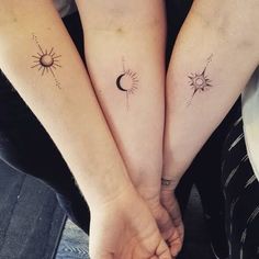 two girls with matching tattoos on their arms holding hands and sun and moon tattoo designs