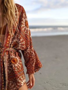 The Kimono Romper | Post Surf Collective Bohemian Printed Kimono For Beach Cover-up, V-neck Printed Kimono For Festivals, Hippie Printed Kimono For Beach Cover-up, Traditional V-neck Kimono For Summer, Traditional Printed Kimono For Beach Cover-up, Summer Paisley Print Kaftan, Festive Bohemian Floral Print Kaftan, Red Beachwear Kimono For Festival, Bohemian Boho Print Kimono For Beach Season