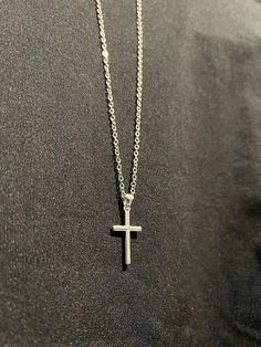 The Serene Cross is a stunning piece that captures the essence of tranquility and divine grace. Crafted by Christians, this cross pendant exudes an elegant simplicity that makes it a timeless accessory. The clean lines and smooth finish give the Serene Cross a sophisticated, minimalist aesthetic, perfect for everyday wear or special occasions. Minimalist Cross Pendant Necklace With Clavicle Chain, Minimalist Clavicle Cross Chain Jewelry, Minimalist Cross Pendant Necklace As Gift, Minimalist Clavicle Chain Crucifix Jewelry, Minimalist Crucifix Clavicle Chain Jewelry, Silver Minimalist Cross Necklace With Clavicle Chain, Simple Clavicle Chain Cross Jewelry, Simple Cross Clavicle Chain Jewelry, Silver Crucifix Cross Necklace For Everyday