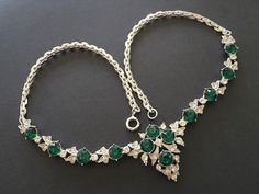 "Beautifully made necklace signed Ora, a company founded in the 1930s that made lovely and elegant rhinestone pieces. This necklace features large deep green round rhinestones in bright silver tone settings. Like all Ora pieces, this necklace has a lot of sparkle. With an elegant and heavy drape, this choker is perfect for a special occasion. CONDITION/SIZE: In like new condition. Approximately 16\" long with the centerpiece being a bit over 1\" long. LINKS: Looking for a VINTAGE NECKLACE, but t Women 1940s, Vintage Rhinestone Necklace, Green Stones, Silver Choker, Rhinestone Jewelry, Rhinestone Necklace, Vintage Rhinestone, Vintage Costume Jewelry, Green Stone