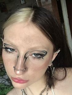 Trible Makeup Look, Rave Makeup Eyeliner, No Eyebrow Makeup, Drawn On Eyebrows, Crazy Makeup Looks, Grunge Eyeliner, Cross Makeup, Eyeliner Art, No Eyebrows