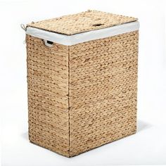 a large woven laundry basket with white lid