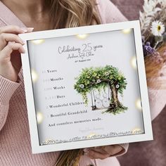 a woman holding up a poster with the date and time for her wedding day on it