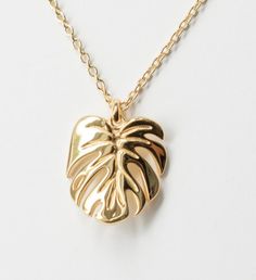 Inspired by my very own Monstera deliciosa, this gorgeous Monstera Deliciosa leaf necklace is plated in White Gold and has a Mirror- like finish. This is a stunning necklace that makes the perfect gift the nature enthusiast. | Inspired by my very own Monstera deliciosa, this gorgeous Monstera Deliciosa leaf necklace is plated in White Gold and has a Mirror- like finish. This is a stunning necklace that makes the perfect gift the nature enthusiast. | 1-800-Flowers Gifts Delivery Monstera Delicios Leaf-shaped Yellow Gold Necklace, Yellow Gold Leaf Necklace As Gift, Leaf-shaped Yellow Gold Necklace For Gift, Yellow Gold Leaf Necklace For Gift, Gold Leaf-shaped Jewelry Gift, Gold Plated Leaf-shaped Jewelry For Gifts, Leaf-shaped Yellow Gold Plated Jewelry, Yellow Gold Plated Leaf-shaped Jewelry, Gold Plated Leaf-shaped Jewelry