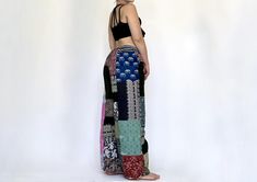 These Leah pants are perfect for a comfortable and stylish night's sleep. Made with a drawstring waist and unique patchwork design, each pair is one-of-a-kind. Enjoy a cozy fit and individuality with every purchase. Measurements:  waist: 24-43' Materials: Cotton Bohemian Black Patchwork Bottoms, Beach Wide Leg Patchwork Pants, Beach Patchwork Wide Leg Pants, Multicolor Patchwork Beach Pants, Multicolor Patchwork Pants For Loungewear, Patchwork Long Pants For Loungewear, Multicolor Patchwork Bottoms For Loungewear, Womens Trousers, Womens Pants