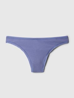 Soft, comfy stretch cotton knit thong.  Elasticized trim along waistband and leg openings.  Made with 92% organically grown cotton.  Organic cotton is better for people and the environment because it's grown without the use of harmful synthetic pesticides and fertilizers.  Low rise.  High-cut leg.  Minimal back coverage. Fitted Cotton Bottoms With Moderate Coverage, Basic Cotton Brief Bottoms, Seamless Cotton Brief Bottoms, Cotton Bottoms With Moderate Coverage For Everyday, Blue Cotton Bottoms For Relaxation, Basic Seamless Cotton Bottoms, Gap Seamless Cotton Bottoms, Gap Briefs For Loungewear, Fitted Cotton Bottoms From Gap