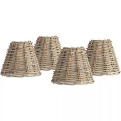 four wicker lampshades are lined up on a white background with one light turned off