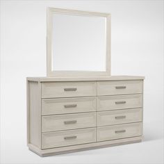 a white dresser with a large mirror on it's top and bottom drawers below