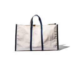 Introducing our versatile Market Tote Bag, made using repurposed materials from tent and sunshade factories. The durable yet affordable design is stylish, eco-friendly, and one-of-a-kind. "In a town in India, all the laborers who walked by use this bag made from unusual pieces of material from factories that make tents and sunshades. The bag is quite useful since it is made from such durable material while still being affordable. Speed was prioritized in the making of this bag so the stitches ar Market Tote Bag, Market Tote, A Town, Market Shopping, Burke Decor, Walking By, Bago, Bag Making, Gym Bag