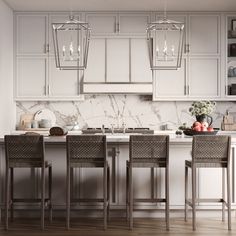 a kitchen with white cabinets and marble counter tops, four chairs at the island in front of the sink