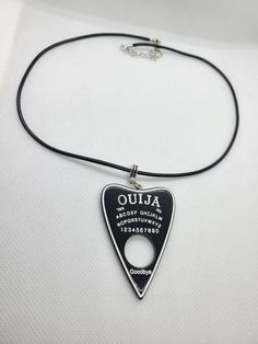 Ouija Planchette Necklace  17 Inches in Length with added chain to adjust FREE SHIPPING WITHIN CANADA - Orders are sent via letter mail & do not come with tracking. Please keep this in mind. If you would like tracked shipping, please select it at checkout. Processes & Ships within 1-2 Business Days from Canada Adjustable Punk Style Necklace For Gift, Edgy Adjustable Nickel-free Necklace, Grunge Necklace With Adjustable Chain, Grunge Necklace With Adjustable Chain As Gift, Grunge Necklace With Adjustable Chain For Gift, Grunge Choker For Halloween Gift, Black Gothic Necklace With Soldered Details, Grunge Jewelry For Halloween Gift, Adjustable Nickel Free Halloween Necklaces