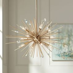 a chandelier hanging from a ceiling in a room