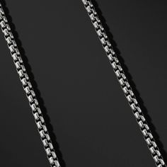 Catalyst is a modern version of the classic Italian Box Chain. This elegant Box Chain features interlocking links with rounded edges, complete with Forziani signature oversized clasp. Catalyst Chain is perfect for layering yet stands out on its own as a statement piece. Catalyst Box Chain Necklace Chain Width: 8mm Wide Chain Length: 26" and 30" Core Material: Stainless Steel Finish: Silver PVD Coated Clasp: Lobster Closure Formal Box Chain Link Necklace, Modern Sterling Silver Link Chain Jewelry, Modern Jewelry With Box Chain Link, Modern Box Chain Link Jewelry, Timeless Box Chain Necklace With Rectangular Links, Elegant Silver Link Chain Necklace, Formal Black Box Chain Necklace, Formal Link Chain Necklace With Cable Chain, Formal Cable Chain Necklace With Link Shape