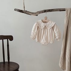 Introduce your little one to timeless elegance with this soft, breathable cotton-linen romper. The long sleeves and minimalist design make it ideal for year-round wear. Featuring a delicate natural texture, this romper combines simplicity with style for any occasion. Snap closures at the crotch ensure easy diaper changes. Features: Made from a premium blend of cotton and linen Snap closures for convenience Long sleeves for year-round versatility Natural, soft fabric perfect for sensitive skin Long Sleeve Cotton Bubble Romper, Cream Long Sleeve Bubble Romper For Summer, Cream Long Sleeve Cotton Jumpsuit, Cream Long Sleeve Jumpsuits And Rompers For Spring, Cream Long Sleeve Jumpsuits For Spring, Summer Cream Long Sleeve Jumpsuits And Rompers, Cream Long Sleeve Jumpsuits And Rompers For Summer, Cream Long Sleeve Jumpsuits For Summer, Bamboo Shop