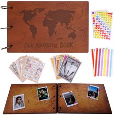 an open wooden book with pictures and stickers on the pages next to it is a world map