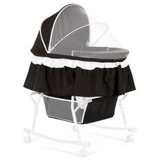 a black and white baby crib with a canopy