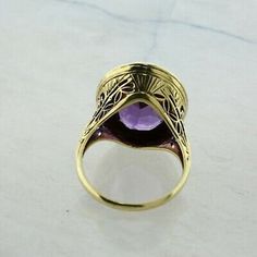 Vintage 14K Yellow Gold 5 ct Amethyst Ring, 11x14mm rich purple amethyst gold bezel halo tooled, .75 inch across, Ring size 6, Circa 1950, 5.5 grams Stock # BB259R16 This listing contains photographs of the actual item you will receive. Our items are in excellent condition with little or no signs of wear and many are one of a kind pre-owned estate finds. Please look closely at the pictures in this listing as they are part of the product description. Please read the description, as any imperfecti Luxury Round Cabochon Amethyst Ring, Luxury Yellow Gold Amethyst Ring With Bezel Setting, Formal Yellow Gold Amethyst Ring With Bezel Setting, Luxury Purple Cabochon Amethyst Ring, Formal 14k Gold Amethyst Ring, Luxury Purple Amethyst Cabochon Ring, Gold Amethyst Ring With Halo Setting, Fine Jewelry, Formal 14k Stamped Amethyst Ring, Fine Jewelry Purple Amethyst Cabochon Ring