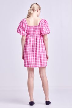 A summertime must-have, this Gingham Linen Sweetheart Baby Doll is as comfortable as it is chic. With its textured fabric, gingham print and sweetheart neckline, this mini dress is perfect for a day spent exploring the city or relaxing on the beach. The short puff sleeves and side pockets add a touch of femininity and functionality, while the lining ensures a perfect fit. For best results, hand wash cold and iron low. Textured Gingham Sweetheart neckline Short puff sleeves Mini length Side pockets Lining Shell: 50% Polyester 50% Cotton Lining: 80% Polyester 20% Cotton HN334D Total length: 35.50" Bust: 33.75" S POWDER BLUE: Height 5'8.5" / Bust 32" / Waist 24" / Hip 34" PINK: Height 5'10" / Bust 32" / Waist 24" / Hip 35" Picnic Mini Dress With Smocked Bodice, Mini Length Smocked Bodice Dress For Picnic, Picnic Mini Length Dress With Smocked Bodice, Mini Length Dresses With Smocked Bodice For Picnic, Pink Ruffled Mini Dress For Picnic, Gingham Short Sleeve Dress With Smocked Bodice, Cute Pink Mini Dress With Smocked Bodice, Short Sleeve Gingham Dress With Smocked Bodice, Gingham Dress With Smocked Bodice And Short Sleeves