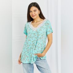 This Floral Top Is A Spring/Summer Must-Have! The Beautiful Lace V-Neck Detail Is A Great Touch To The Bright Floral Pattern, Making It Very Feminine And Soft. The Styling Options Are Endless Because Of The Simple Loose T-Shirt Look. Pattern Type: Floral Style: Casual Features: Lace Neckline: V-Neck Length: Long Sleeve Length: Short Sleeves Sleeve Type: Raglan Sleeves Sheer: No Material Composition: 92% Polyester, 8% Spandex Stretch: Highly Stretchy Care Instructions: Machine Wash Cold. Tumble D Casual Floral Print V-neck Top For Summer, Light Blue V-neck Top For Vacation, Summer Lace Trim Loungewear Top, Summer Lace Trim Top For Loungewear, Light Blue Floral Print V-neck Top, Summer Short Sleeve V-neck Top For Loungewear, Spring Cotton V-neck Top For Loungewear, Summer V-neck Top With Short Sleeves For Loungewear, Cotton V-neck Top For Spring Loungewear