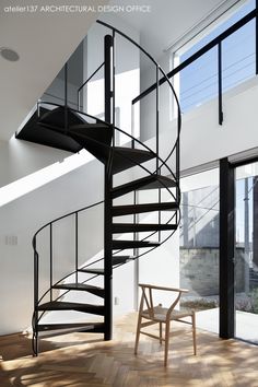 a spiral staircase in the middle of a room