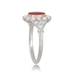 A 1.18ct ruby with a deep red saturation centers the handcrafted platinum ring. The ruby center stone is bezel set in yellow gold and is framed by a floral motif of the diamond halo. The shoulders are also adorned by diamonds. ✦DIAMOND SPECIFICATIONS: Center Stone Size: 1.18-Carats ✦ ENGAGEMENT RING SPECIFICATIONS: Ring Material: Platinum ✦ WHAT COMES IN YOUR SHIPMENT: - Your Engagement Ring - Quality Ring Box - Jewelry Cleaner - UGL Certificate ✦ WHY SHOP WITH US: - We've been in business for 4 Exquisite Oval Ruby Ring Gia Certified, Gia Certified Oval Platinum Cluster Ring, Luxury Oval Ruby Ring With Halo Design, Heirloom Oval Ruby Ring Gia Certified, Gia Certified Heirloom Oval Ruby Ring, Heirloom Oval Gia Certified Ruby Ring, Exquisite Oval Cluster Ring In Platinum, Heirloom Diamond Flower Ring, Oval Shaped, Heirloom Diamond Flower Ring Oval