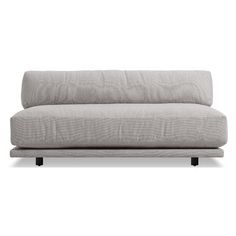 a gray couch sitting on top of a white floor