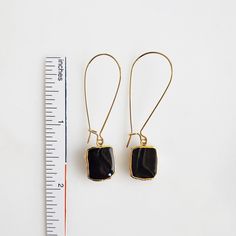 Where the timeless elegance meets modern vibes, that's where you'll find these drop earrings. GEMSTONE: Black Onyx CLOSURE: Gold plated kidney ear wires LENGTH: 2" long Chic Metal Linear Earrings With Ear Wire, Chic Linear Dangle Earrings With Ear Wire, Chic Dangle Linear Earrings With Ear Wire, Everyday Adjustable Teardrop Linear Earrings, Elegant Adjustable Hoop Earrings With Ear Wire, Black Teardrop Brass Jewelry, Black Minimalist Jewelry With Ear Wire, Minimalist Black Earrings With Ear Wire, Adjustable Elegant Linear Earrings For Everyday