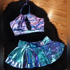 Holographic Strappy Halter Crop Top And Ruffle Mini Skirt Metallic Festival 2 Piece Set Women's Size Medium Perfect For Rave, Festival, Dancewear, Party, Sexy, Cosplay, Pin-Up, Boudior Photos, Dress-Up Nwot! Super Soft And Shiny! 80% Polyester 15% Cotton 5% Spandex Purple Ruffled Skirt For Party, Party Purple Ruffled Mini Skirt, Fitted Purple Skirt For Club, Party Mini Skirt With Ruffles In Purple, Fitted Purple Mini Skirt With Ruffles, Stretch Blue Mini Skirt For Club, Purple Party Skort For Spring, Fitted Multicolor Skort For Party, Holographic Rave Outfit