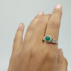 Green onyx Gemstone 925 silver ring with stylish design for your daily wearing accessories. This green stone also know as green onyx stone boho ring can make your daily fashion goals more interesting  and trendy. The green onyx associated with Mercury (Buddha) planet. which help you to financial clearance and sort out, educational and medical recovery   and help you to maintain it. If you searching for something that gives your fashion style extra wing and helps you in health benefits, financial success than this stone ring is for you. This can be the perfect gift for your loved ones, family and friends.  Rings Details  Metal: 925 Sterling Silver Gemstone : Green onyx Gemstone Shape: Round SKU :  Ring59 Ring Size : All Size Available For more new arrivals  and discount please favorite our Adjustable Fit Emerald Ring, Bohemian Adjustable Silver Emerald Ring, Bohemian Sterling Silver Emerald Ring, Bohemian Adjustable Emerald Open Ring, Bohemian Emerald Adjustable Open Ring, Green Turquoise Bohemian Promise Ring, Green Bohemian Turquoise Promise Ring, Bohemian Emerald Promise Ring, Handmade Adjustable Green Emerald Ring