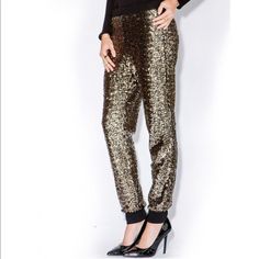 Dull Gold All Sequin Pants Currently Very On Trend Black Elastic Waistband No Black Cuffs At Bottom Of Panta ( Pictures Are To Show How Pant Fits And Color Of Sequin) Material/Composition Outer Shell: 94% Polyester 6%Spandex/Elastane Lining 92% Polyester 8% Spandex/Elastane Waist Band 12 In But Lots Of Room For Stretch Length From Top Of Waist Band To Bottom 37 In Inseam 27.5 In Trendy Party Bottoms With Tapered Leg, Trendy Tapered Leg Party Bottoms, Trendy Tapered Leg Pants For Party, Glamorous Stretch Bottoms For Winter, Glamorous Pants With Elastic Waistband For Night Out, Stretch Pants For Winter Party, Glamorous Stretch Bottoms For Going Out, Forever 21 Fitted Bottoms For Going Out, Fitted Forever 21 Bottoms For Going Out