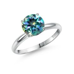 a white gold ring with a blue diamond