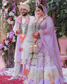 the newly married couple is posing for a photo