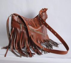 LEATHER BOHO BAG WITH FRINGESThis Handbag is the perfect size to carry your daily essentials in style! It is made from high quality leather.This leather bag is a perfect everyday bag! There is a lot of space and you can put there everything in your everyday life.* Different colors* Lining* An external pocket on the back* Includes internal pockets for mobile phone and other small items.Dimensions:height: 31 cm (12.2 in)width: 39 cm (15.3 in)strap: max 130 cm (51.2 in)***************************** Tasseled Shoulder Bag For Daily Use, Daily Use Pouch Bag With Tassels, Fringe Pouch Bag For Everyday Use, Daily Use Satchel Shoulder Bag With Tassels, Daily Use Satchel Bag With Tassels, Travel Fringe Pouch Shoulder Bag, Travel Shoulder Bag With Fringe And Pouch Shape, Travel Shoulder Bag With Tassels, Travel Shoulder Bag With Fringe In Pouch Shape