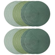 four green placemats with circular designs on each side and one in the middle