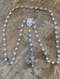 This is a perfect gift for a Godmother. Hand made very strong rosary. Made with glass pearl beads, beautiful silver plated hearts with the word GODMOTHER on the rosary, Stainless steel and silver plated Findings, a traditional Rosary Centerpiece and a traditional Catholic crucifix. All of my Rosaries are handmade by myself. I take pride in my work. I use quality and strong products. I make my Rosaries to last so you can enjoy them and pass them down to future generations! As always, if you have Catholic Crucifix, Godmother Gifts, Catholic Rosary, The Rosary, Rosary Catholic, Rosary Beads, Baptism Gifts, Christening Gifts, Godmother