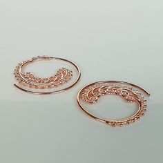 Indian style sterling silver spiral ear hoops. These are dipped in rose gold. Dimensions: 25 mm x 26 mm Price listed is for a pair. These earrings are made of 925 hypoallergenic sterling silver and rose gold All my pieces are sent in a gift box. I can include a personal message from you if needed. You are welcome to contact me at... bhavnakwintra1956@gmail.com More hoops: https://www.etsy.com/your/shops/TheSilverGame/tools/listings/section:26305414 More earrings: https://www.etsy.com/your/shops/ Ear Wire, Gold Bracelet, Hoop Earrings, Rose Gold, Gifts For Her, Sterling Silver, Pink, Gold, Silver